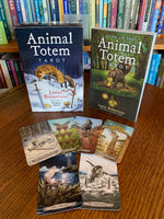 Load image into Gallery viewer, Photo of the whole set of The Animal Totem Tarot takes the best of the tarot and merges it with the best of the animal totem world (some people call them spirit animals or power animals). &quot;This guide takes you by the hand and walks you through totemic experiences that answer your most pressing questions. Set includes 78 cards, a guidebook and box for storing them. Cost is $28.99.
