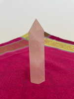 Load image into Gallery viewer, Alternate view. Rose Quartz tower of love 💗. Beautiful rose quartz tower for your altar, for healing or as décor for any room in your home or office. Rose quartz is the ultimate love stone, for love of all types - to attract love and for self-love. It is soothing, enhances compassion, is the best emotional healer, dispels negative energy, opens your heart and so much more. Approx. 3¾&quot; long. See photos below for views of all sides. Cost is $18.00.

