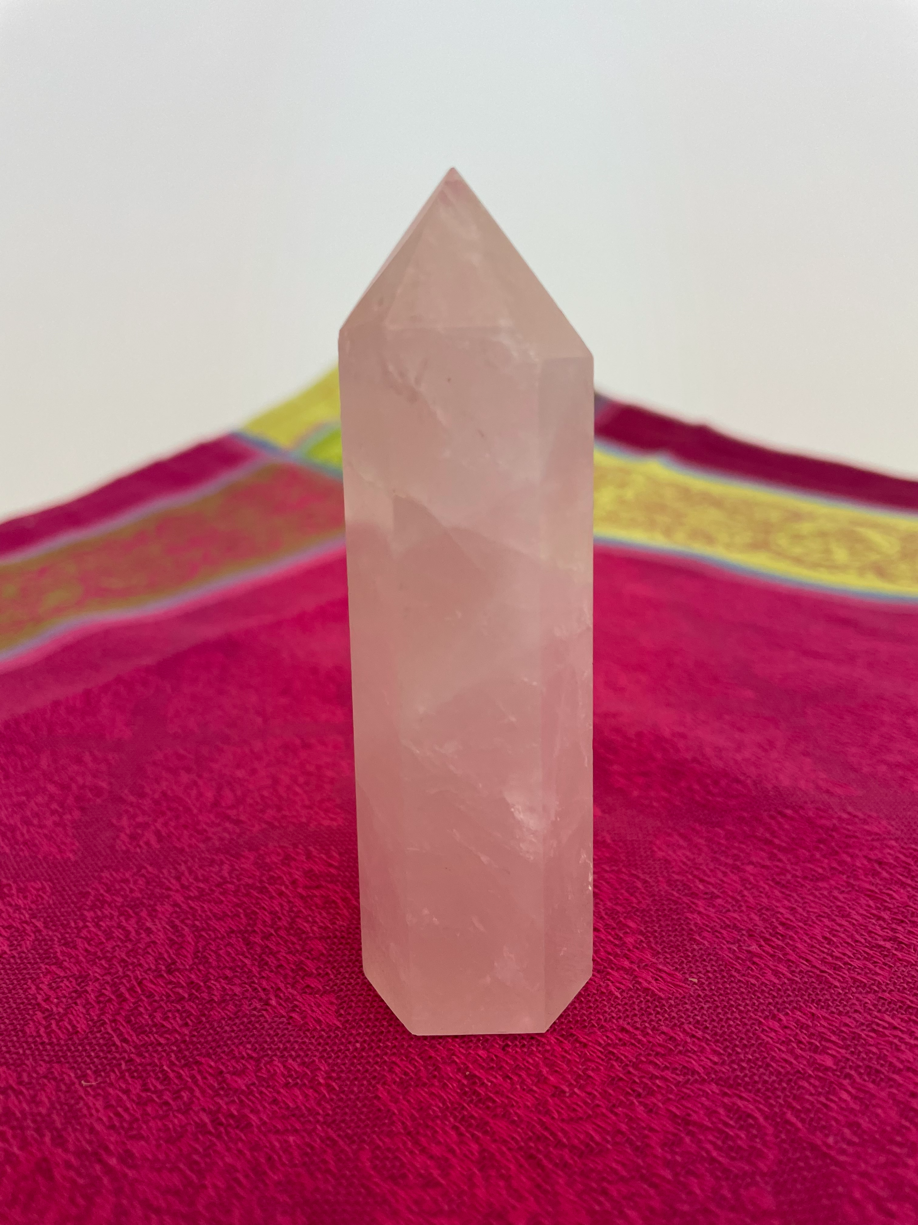 Alternate view. Rose Quartz tower of love 💗. Beautiful rose quartz tower for your altar, for healing or as décor for any room in your home or office. Rose quartz is the ultimate love stone, for love of all types - to attract love and for self-love. It is soothing, enhances compassion, is the best emotional healer, dispels negative energy, opens your heart and so much more.  Approx. 3¾" long. See photos below for views of all sides. Cost is $18.00.