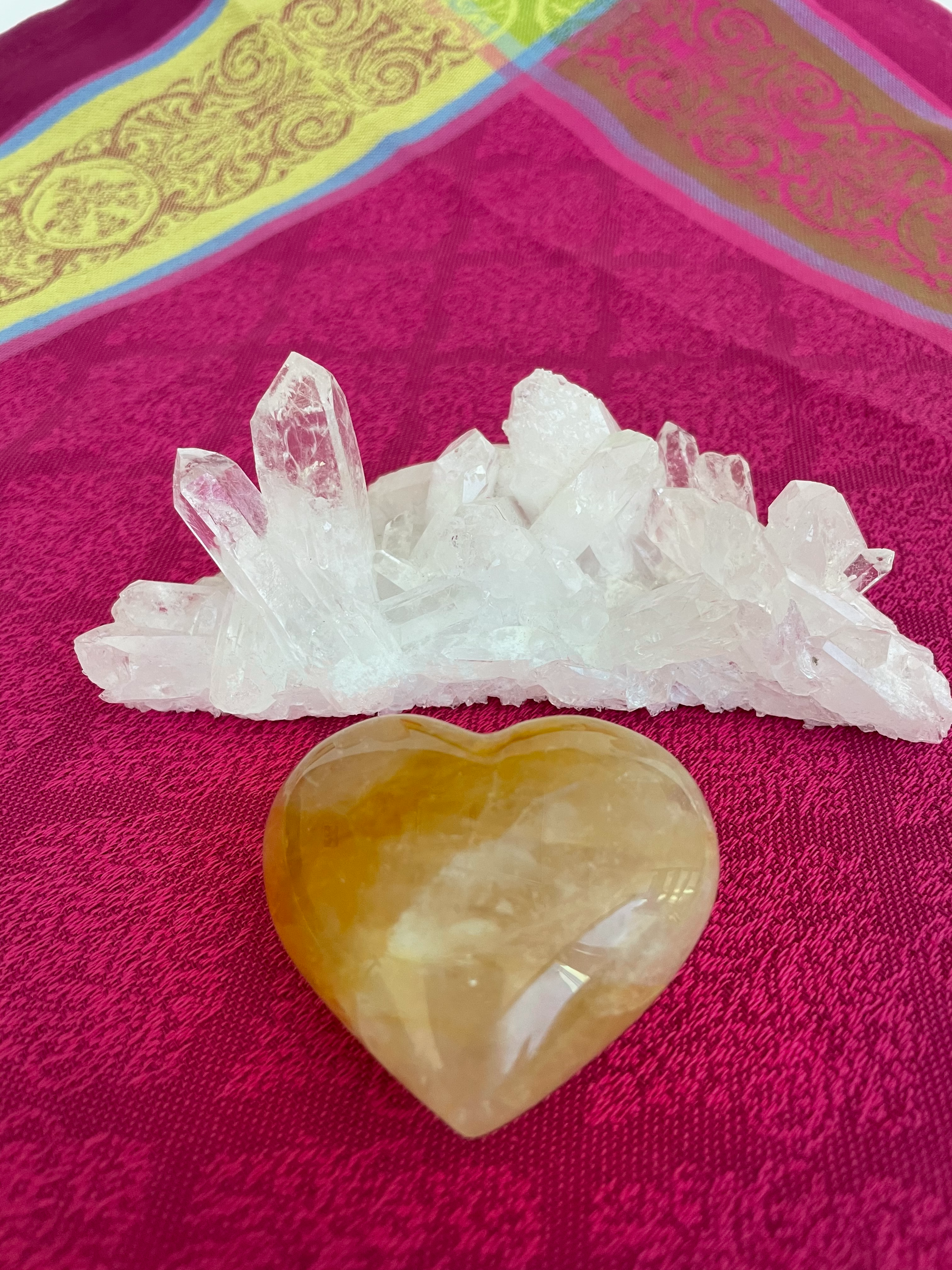 Reverse side. Beautiful citrine (yellow quartz) heart! Great to place on your altar or bookshelf, to hold during meditation, to use for healing or as a décor item in your home of office. Citrine absorbs and dispels negative energy, is a stone of abundance - attracting money, prosperity and success, warming & energizing, enhances creativity, brings a positive attitude, is cleansing and more. This citrine heart is approximately 2" at it's widest expanse. Cost is $24.