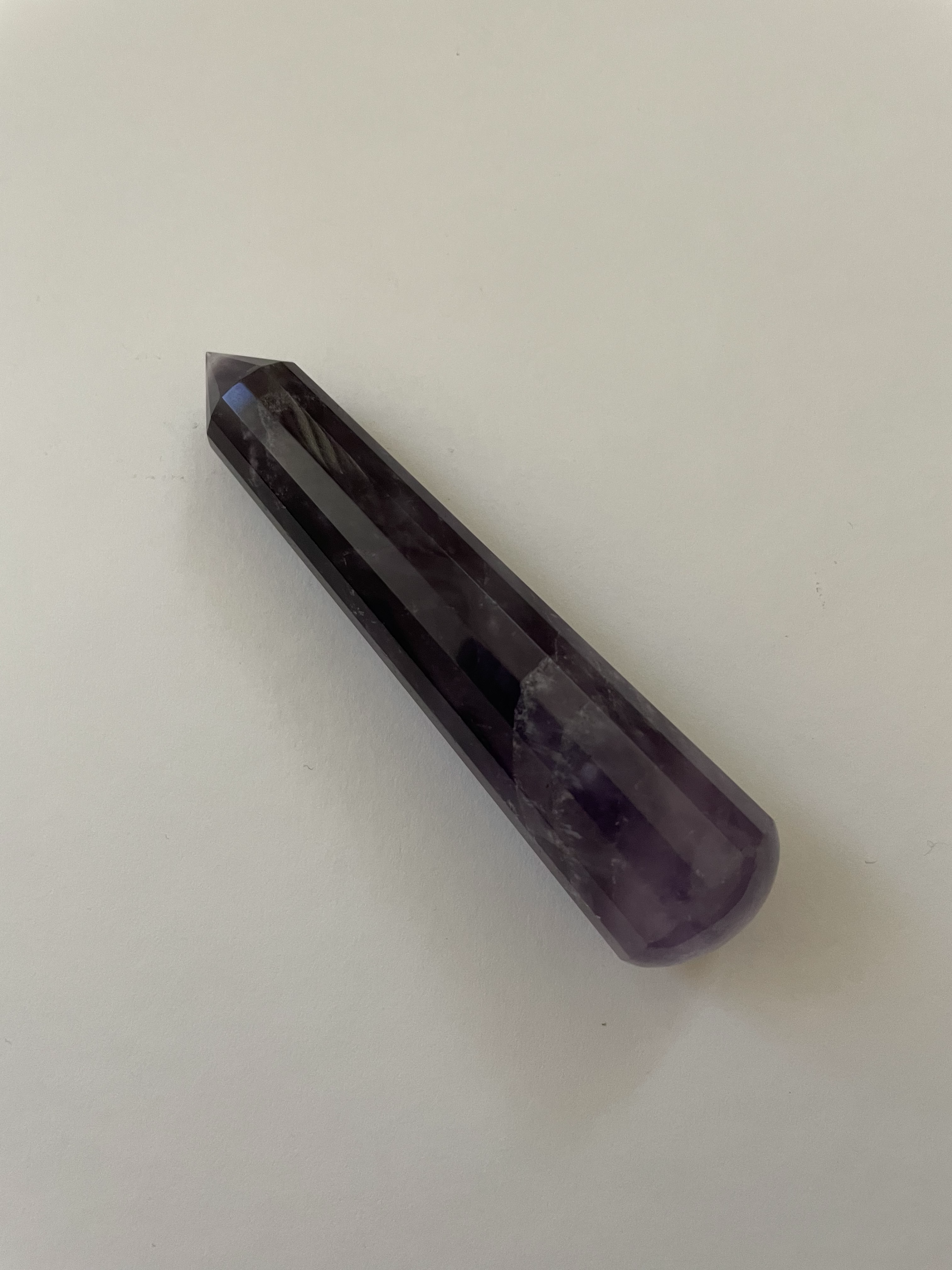 Alternate view. Gorgeous, 16-sided amethyst healing wand, with stunning craftsmanship. This high quality, deep purple amethyst wand can be used for healing and works especially well for "people recovering from any type of poor health - emotional, mental, physical or spiritual "and can aid in finding one's true path (ravenscrystals.com). It is approx. 3¾" long. Cost is $30.