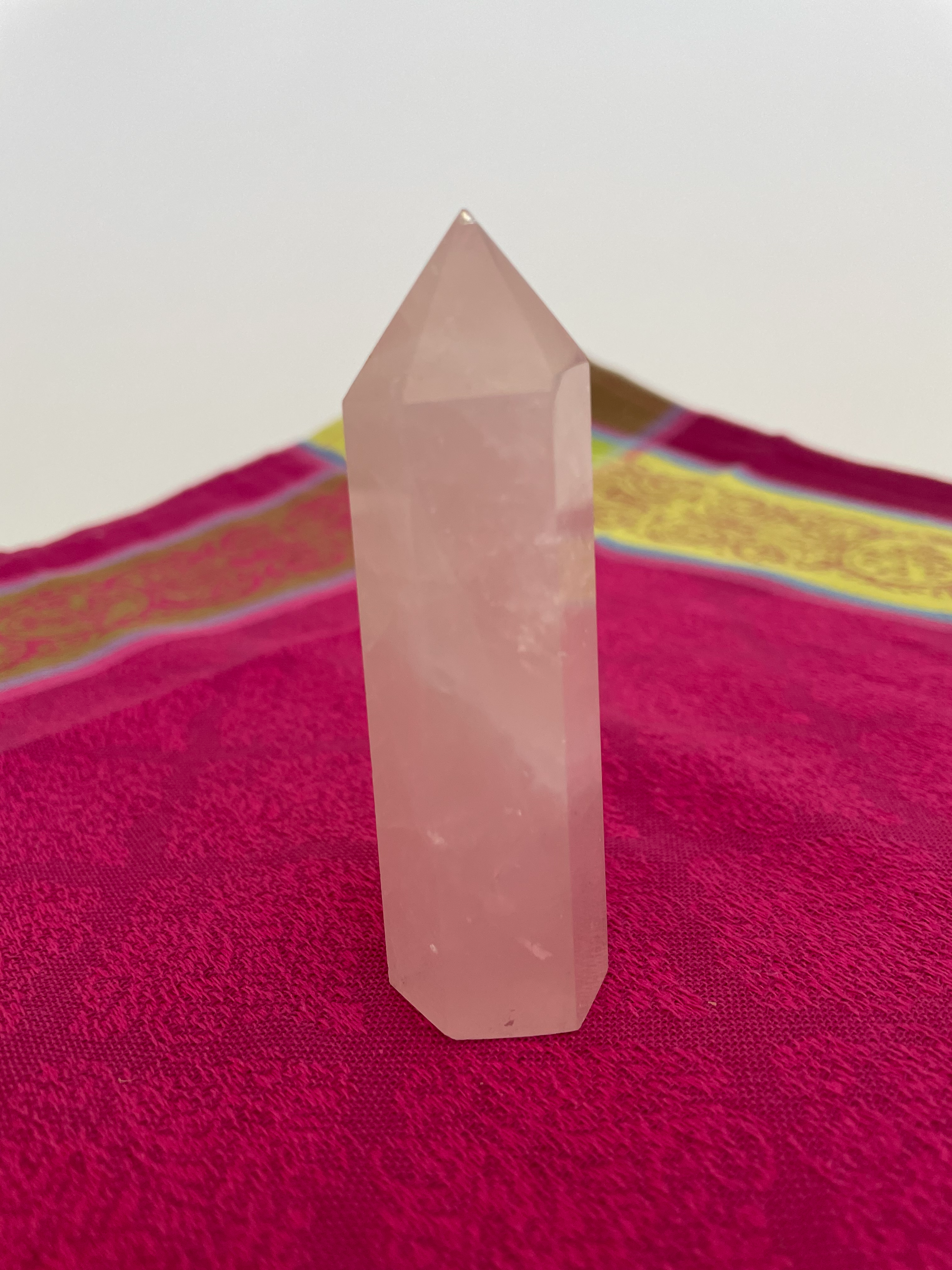 Alternate view. Rose Quartz tower of love 💗. Beautiful rose quartz tower for your altar, for healing or as décor for any room in your home or office. Rose quartz is the ultimate love stone, for love of all types - to attract love and for self-love. It is soothing, enhances compassion, is the best emotional healer, dispels negative energy, opens your heart and so much more. Approx. 3¾" long. See photos below for views of all sides. Cost is $18.00.