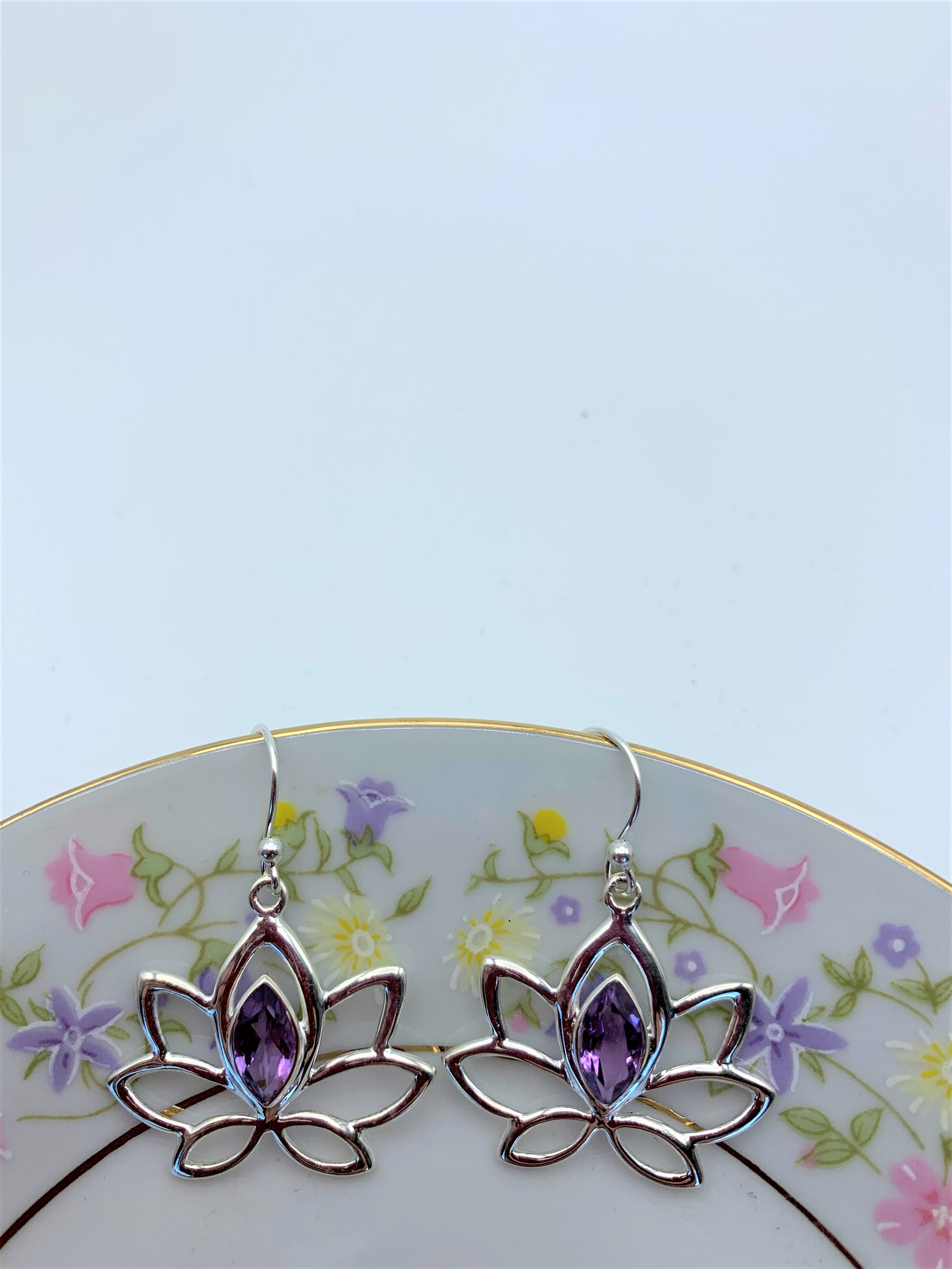 Marquise shaped amethyst set at the top of a  large open sterling silver lotus. Wires, not posts and approximately 1¾" long.  See matching pendant. 