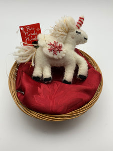 This is a unicorn Christmas ornament that is hand-crafted (fair trade) and made of 100% natural wool. It is off-white with a red and white striped horn, golden threads within its mane, has black accents (hooves, mouth, etc.) and has the 'signature' (red) snowflake on it's wing.  It is approximately 5"x4" (with the tail being extra 1.5"). It comes with a detachable fair trade holiday "to/from" tag to be used if giving as a gift.