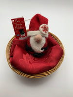 Load image into Gallery viewer, This is a Santa Claus Ornament that is handcrafted (fair trade) and made with 100% natural wool.  He has a red body and a red hat with white trim, a long beard, a round nose and black accents (belt and feet/boots). Approximately 4&quot;x2.25&quot;.  He comes with a fair trade holiday &quot;to/from&quot; tag to use if giving this as a gift. 

