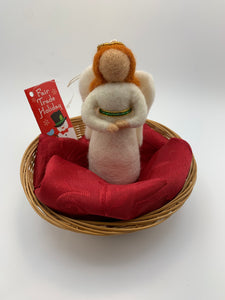 This angel (light skin) Christmas ornament is handcrafted (fair trade) and made of 100% natural wool.  She wears a white dress with gold & green beading around an empire waist, has white wings, a gold beaded halo and bendable arms.  Approximately 5" tall.  She comes with a detachable fair trade holiday tag to use if you are giving this as a gift. 