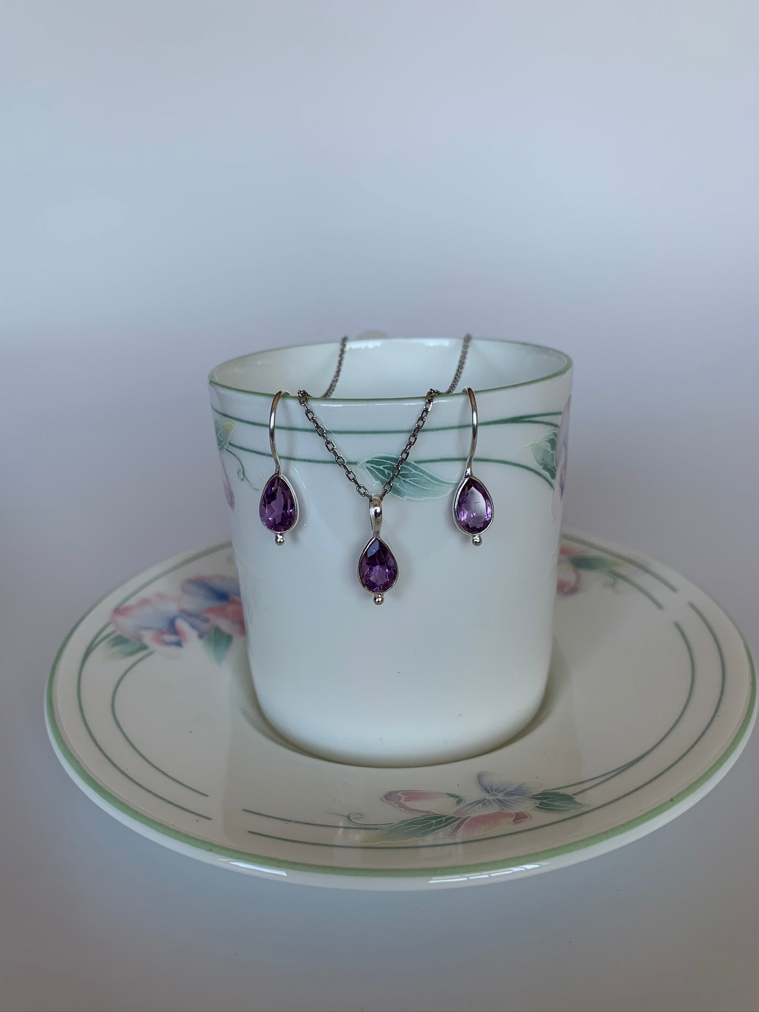 Earrings & pendant birthstone set (February). Small teardrop amethyst gemstones set in sterling silver. Earrings have wires, not posts.  Necklace chain is not included.