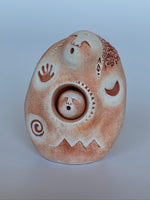 Load image into Gallery viewer, lose-up view. Lovely sacred art sculpture of Mother Goddess with a removable baby in her belly. Mother Goddess, connected to nature and the earth, and having a nurturing bond with all life, reminds us that we can all be a mothers to ourselves and others. She is approximately 2.5&quot; tall. This and their many other sacred clay sculptures are created in Oregon and their deeply inspired and award winning line of clay designs is hand-detailed and finished by the two owners with seasonal help from local artists.
