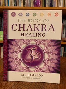 Front cover. The Book of Chakra Healing by Liz Simpson is a "comprehensive guide to the ancient Indian System of chakras." Simpson discusses each of the chakras and how to unblock them and move into a more balanced energy. Liz Simpson is a journalist and author who focuses on alternative healing and personal development. She writes for many national and international magazines as well. Cost is $14.95.