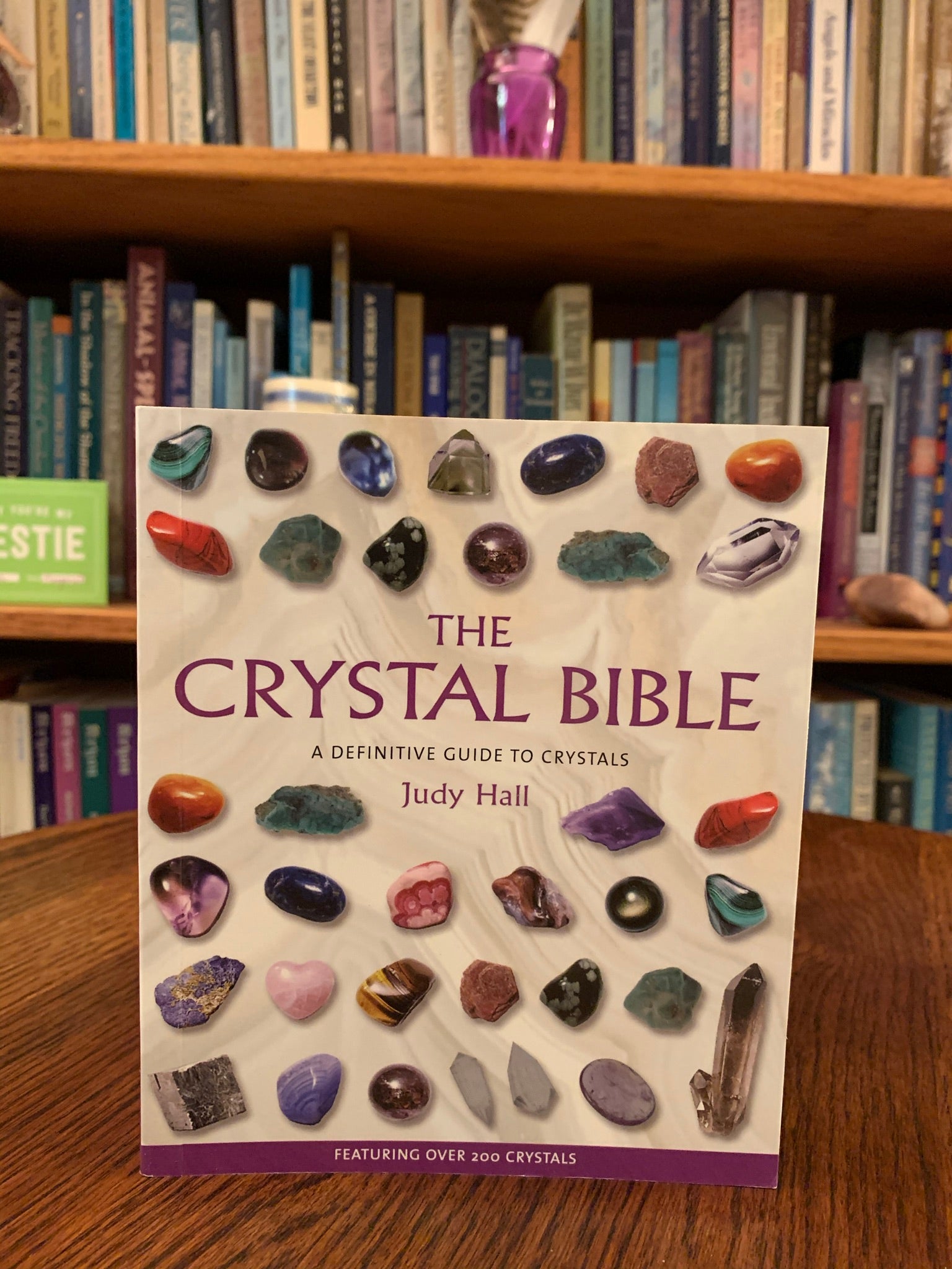 Close-up view of the front cover. The Crystal Bible is a comprehensive book about crystals and gemstones by Judy Hall, an expert in the field. It is 400 pages long and is made with high quality paper. Most of the book is devoted to in depth descriptions of the esoteric and practical properties of stones and crystals, but she also includes sections on crystal care, crystal healing, crystal formation, etc. She has 3 separate volumes of her crystal Bible books and also a book on crystal healing.