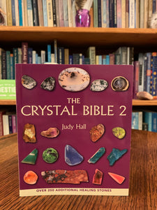 Close-up view of front cover. The Crystal Bible is second comprehensive book about crystals and gemstones by Judy Hall. It includes 200 additional crystals. It is 400 pages long and made with high quality paper. Most of the book is devoted to in depth descriptions of the esoteric and practical properties of stones and crystals, but she also includes sections on crystal protection, crystal history and more. She has written three separate volumes of her crystal Bible books and also a book on crystal healing.