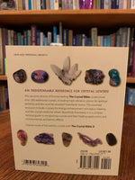 Load image into Gallery viewer, Close-up view of back cover. The Crystal Bible is second comprehensive book about crystals and gemstones by Judy Hall. It includes 200 additional crystals. It is 400 pages long and made with high quality paper. Most of the book is devoted to in depth descriptions of the esoteric and practical properties of stones and crystals, but she also includes sections on crystal protection, crystal history and more. She has written three separate volumes of her crystal Bible books and also a book on crystal healing.
