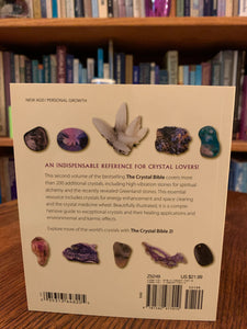 Close-up view of back cover. The Crystal Bible is second comprehensive book about crystals and gemstones by Judy Hall. It includes 200 additional crystals. It is 400 pages long and made with high quality paper. Most of the book is devoted to in depth descriptions of the esoteric and practical properties of stones and crystals, but she also includes sections on crystal protection, crystal history and more. She has written three separate volumes of her crystal Bible books and also a book on crystal healing.