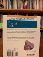 Load image into Gallery viewer, Close-up view back cover. The Crystal Bible 3 is the third comprehensive book about crystals and gemstones by Judy Hall, including 250 additional crystals. It is 400 pages long and made with high quality paper. Most of the book is devoted to in depth descriptions of the esoteric and practical properties of stones and crystals, but she also includes sections on crystal vibrations, crystal skulls and more. She has written three separate volumes of her crystal Bible books and also a book on crystal healing.
