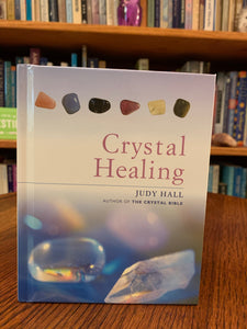 Close-up view of front cover. Crystal Healing is a book by the best-selling author, Judy Hall. In this book, she demonstrates how to use crystals/gemstones to heal yourself on multiple levels. She discusses 12 master healing crystals and how to use them for healing important issues. Check out her Crystal Bible series in our book section!