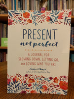 Load image into Gallery viewer, Front cover. Present Not Perfect is a guided journal to help you to let go of trying to be perfect, to release your inner critic and to be present in the moment and accepting and loving of the imperfect person you are - we all are. This journal offers 120 pages of ways to bring more mindfulness - present moments, inspiration, self-understanding and compassion to yourself. It includes colorful illustrations as well as inspiring and self-exploratory words and prompts. Cost is $14.99.
