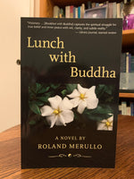 Load image into Gallery viewer, Front cover of Lunch With Buddha. Let me just say that this book and the other two in this series are some of the most enjoyable I have read. I have even re-read them and I rarely do that. This book is fiction, but laced with wonderful spiritual insights and laugh-out-loud moments! It is fun to read and deeply touching to the heart, soul and spirit. The protagonist gets stuck taking a cross-country drive with a spiritual guru and there the fun continues in this second book of the series. Cost is $15.85.
