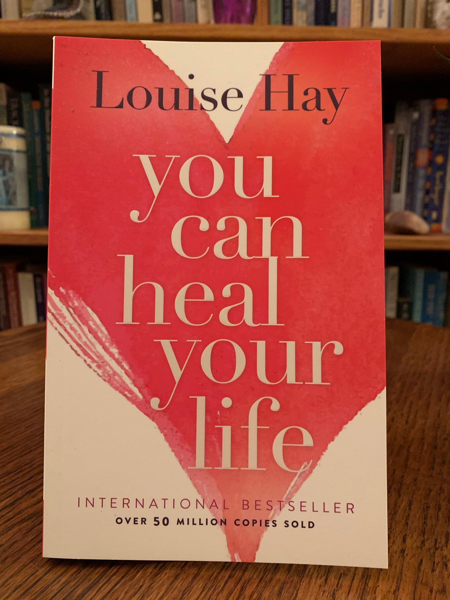 Close-up Front Cover. You Can Heal Your Life by the amazing Louise Hay. This is one of the first books I ever read as I transformed my own life spiritually and re-oriented my belief about healing to a holistic and natural approach. It is a wonderful book with profound information about healing, self-healing and self-love, in which Hay tells her own story of transformation and healing and of how she beat cancer in natural ways. Cost is $15.99.