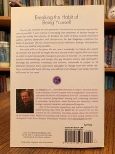 Close-up of back cover of "Breaking the Habit of Being Yourself" by Dr. Joe Dispenza. As you read this book, "not only will you be given the necessary knowledge to change any aspect of yourself, you will be taught the step-by-step tools to apply what you learn in order to make measurable changes in any area of your life...[Dispenza] combines the fields of quantum physics, neuroscience, brain chemisty, biology and genetics to show you what is truly possible. Cost is $16.99