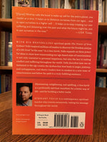 Load image into Gallery viewer, Close-up of back  cover of &quot;A New Earth.&quot; In this book Tolle expands on ideas from his first book The Power of Now - &quot;powerful ideas to show how transcending our ego-based state of consciousness is not only essential to personal happiness, but also the key to ending conflict and suffering throughout the world. Tolle describes how our attachment to the ego creates the dysfunction. His message is simple - stay conscious - in the present moment and don&#39;t allow the mind to lead you away from it. Cost is $17.00
