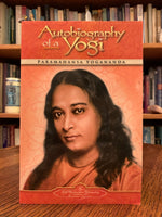 Load image into Gallery viewer, Close-up of front cover. Autobiography of a Yogi by Paramahansa Yogananda is a most wonderful journey to take, walking in Yogananda&#39;s footsteps as he moves through his life - and what an amazing and magical life it was. He was a great spiritual teacher and Yogi. The book was &quot;named one of the best spiritual books of the 20th century. Cost is $12.50
