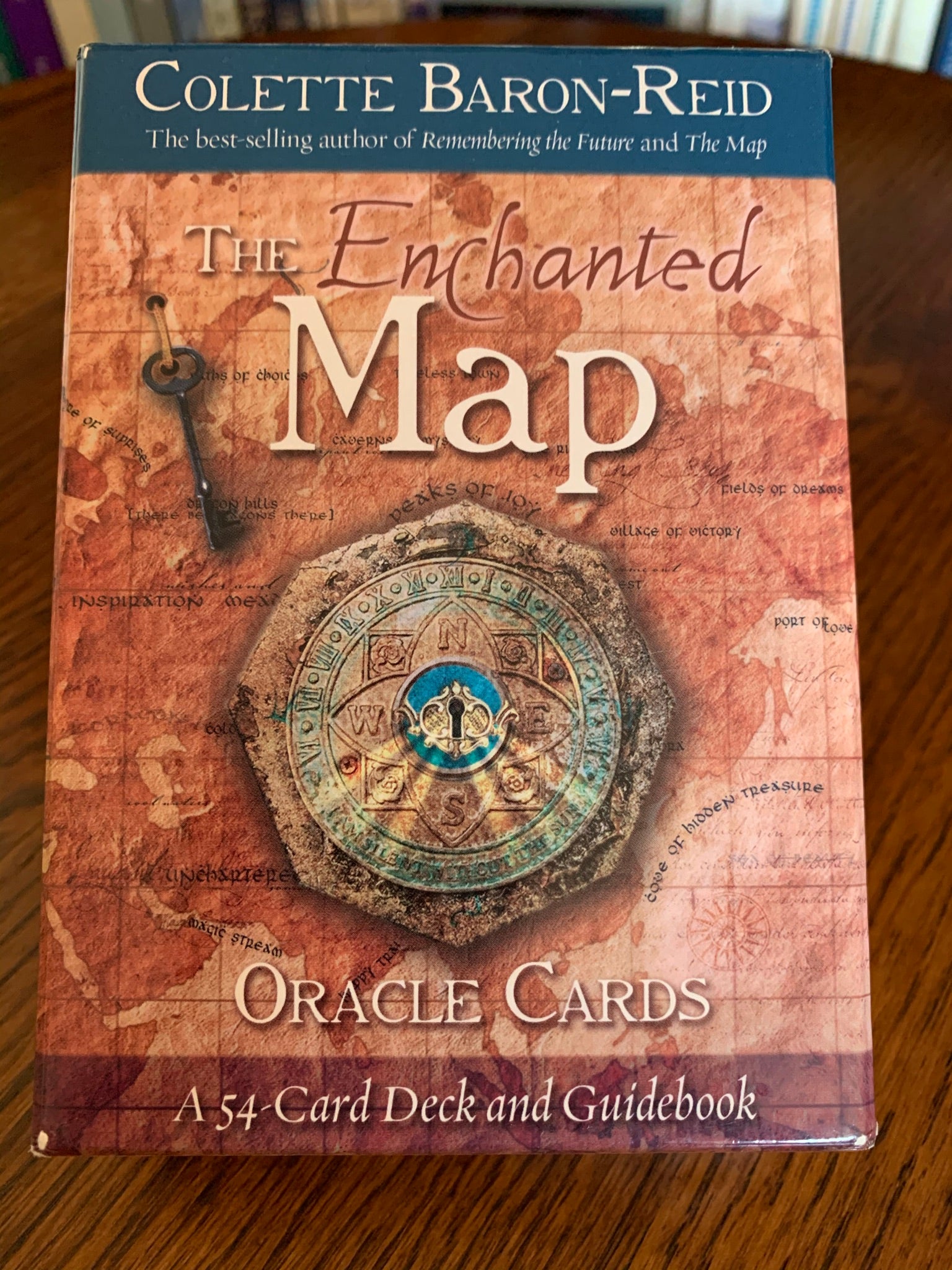  Photo of box front. The Enchanted Map Oracle Cards by Colette Baron Reid, includes 54 cards, a guidebook and an box for storing them. An enchanting deck with lovely artwork. Another one of my favorite decks, it gives you the tough answers (e.g. "rock bottom" & "Ghostlands") which are necessary for self-growth and understanding, as well as uplifting messages (e.g. "Coming to Life" & "Peaks of Joy."). Colette Baron-Reid is a psychic medium, intuitive counselor and best-selling author. Price is $21.99.