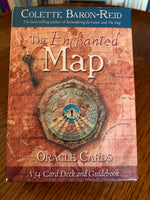 Load image into Gallery viewer,  Photo of box front. The Enchanted Map Oracle Cards by Colette Baron Reid, includes 54 cards, a guidebook and an box for storing them. An enchanting deck with lovely artwork. Another one of my favorite decks, it gives you the tough answers (e.g. &quot;rock bottom&quot; &amp; &quot;Ghostlands&quot;) which are necessary for self-growth and understanding, as well as uplifting messages (e.g. &quot;Coming to Life&quot; &amp; &quot;Peaks of Joy.&quot;). Colette Baron-Reid is a psychic medium, intuitive counselor and best-selling author. Price is $21.99.
