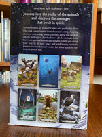 Load image into Gallery viewer, Photo of back of box with a sampling of the cards. The Animal Totem Tarot takes the best of the tarot and merges it with the best of the animal totem world (some people call them spirit animals or power animals). &quot;This guide takes you by the hand and walks you through totemic experiences that answer your most pressing questions.&quot; Set includes 78 cards, a guidebook and box for storing them. Cost is $28.99.
