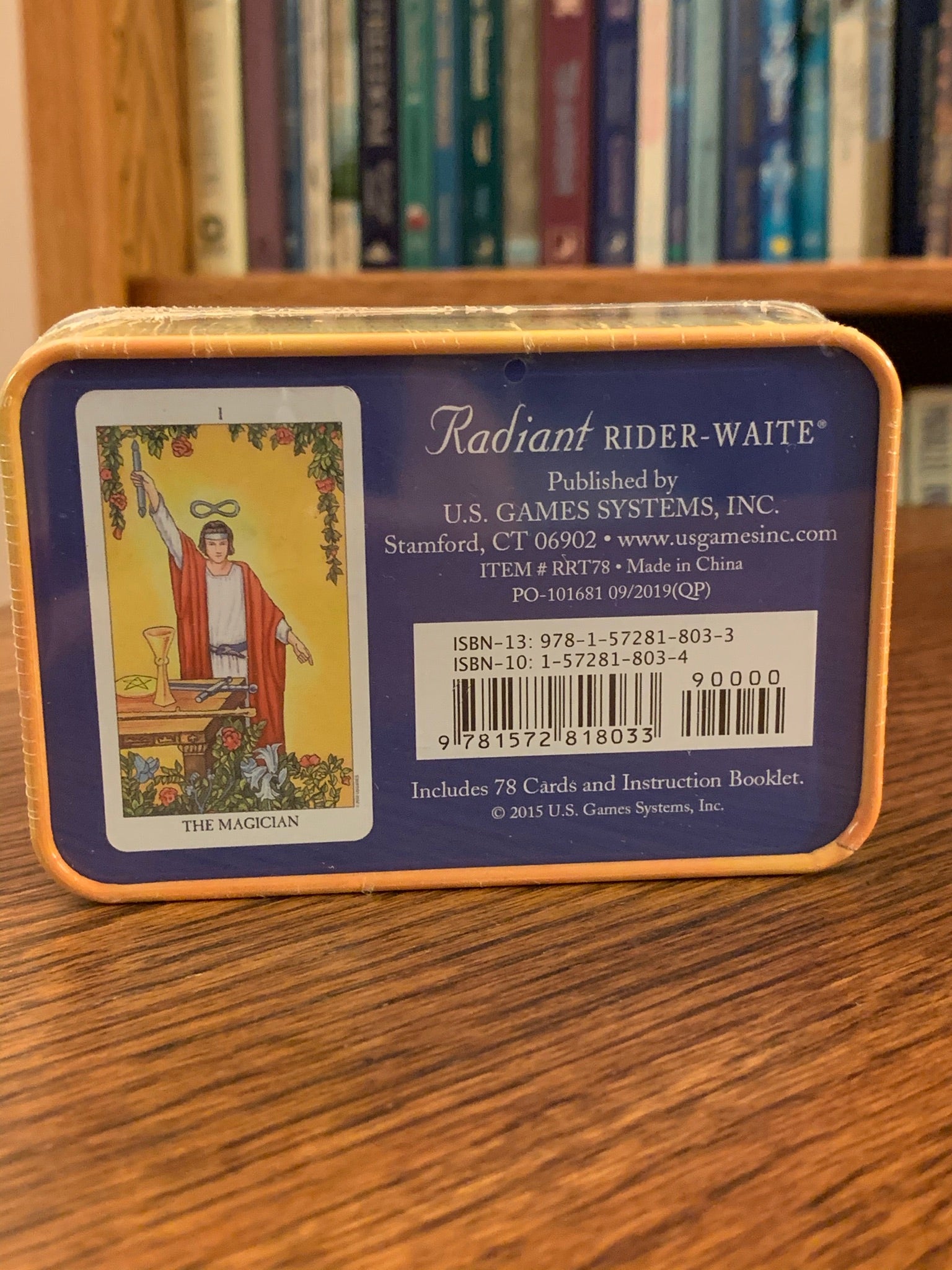 This Radiant Rider-Tarot Deck, takes the traditional illustrations up a notch with enhanced brightness and a lovely new card back, now illustrated with a deep blue, star-filled sky. If you like the traditional tarot, this is the deck for you. The set includes 78 cards, a guide booklet, and a tin for storage (instead of the regular cardboard box). Price is $18.95. This photo is of the back of the storage tin.