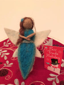 This sweet water-fairy Christmas Ornament wants to bring a little magic into your life.  She is... ♥Handmade ♥Fair Trade (artisans who create these ornaments are paid fair wages for their work). ♥Made from 100% natural hand-felted wool ♥Approximately 5"x2.5" ♥One of the 4 fairy "elements" Christmas Ornaments.  Buy one or collect them all.  ♥Comes with a detachable "fair trade" holiday "to/from" tag to use if you are giving this as a gift. Cost: $11.00