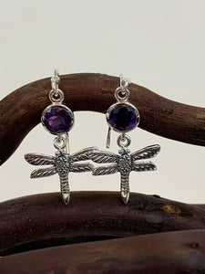 Round amethyst gemstones set above sterling silver dragonflies, which dangle below.  These earrings are lightweight, have wires, not posts and are approximately 1¼" long.