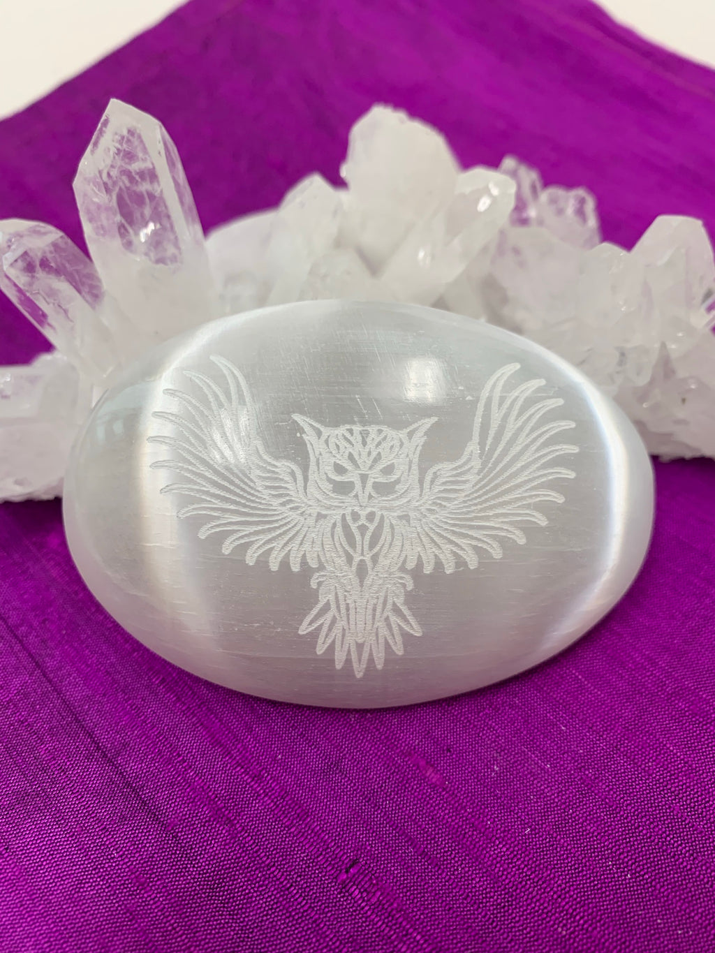 Owl etched on smooth, polished selenite palm stone from our Spirit Animal collection. Selenite ranges from translucent to milky white and is the perfect size to fit in your palm. Average weight is 4.2 oz and it is approximately 3"x2.5". This selenite is ethically sourced and workers receive living wages.