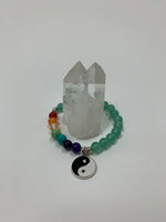 Load image into Gallery viewer, Aventurine gemstone power bracelet, accented by 7 gemstones, one to match each of the 7 chakras and a black and white yin yang charm as well as three additional silver colored beads (The silver base of the charm and the silver colored beads are not sterling silver). The gemstone beads are 8mm.
