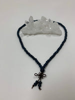Load image into Gallery viewer, Prayer beads/mala necklace consists of 108 small, blue ceramic beads. Used to count 108 repetitions of a mantra, so the user can pay attention to the sounds, vibrations and meaning of the mantra being chanted. 
