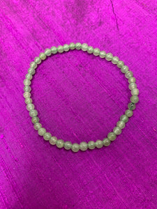 Close-up view. Petite 4mm aventurine gemstone power bracelet. Beads are 4mm. Tiny and mighty, these bracelets put the healing power of aventurine right around your wrist. Buy one or wear and share them with friends or family.