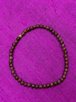 Load image into Gallery viewer, Close-up view. Petite garnet gemstone power bracelet. Beads are 4mm. Tiny and mighty, this bracelet puts the power of garnet right around your wrist. Buy one or buy to wear and share with friends and family - there is a variety of gemstone bracelet choices.

