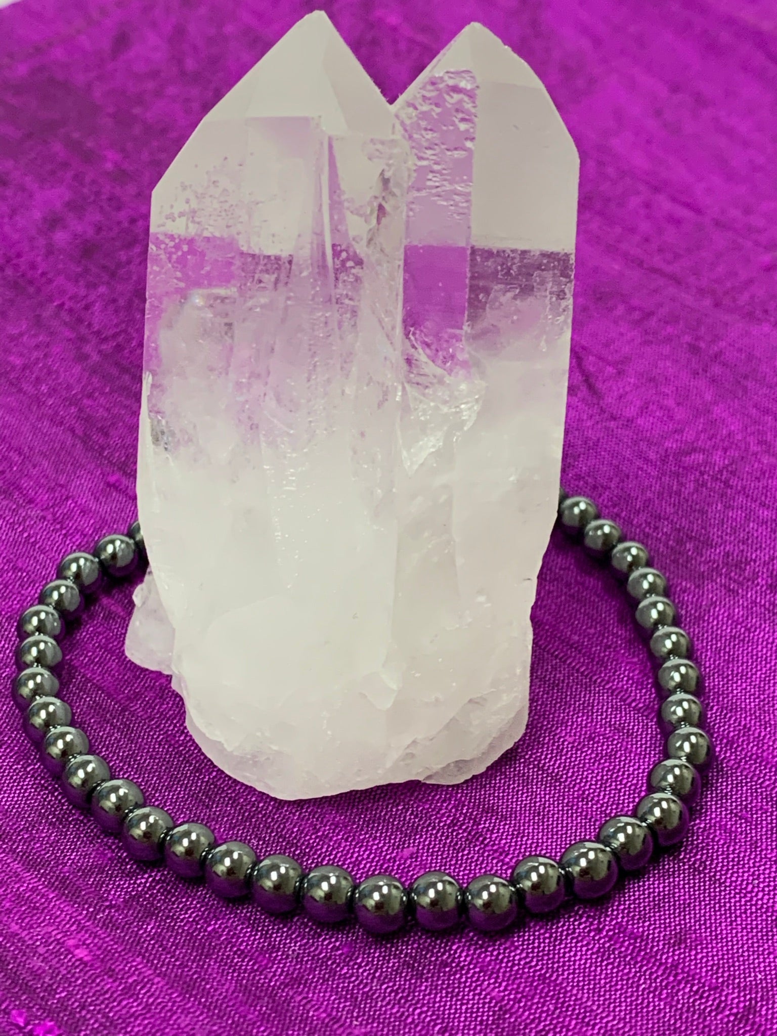 Second close-up view. Hematite gemstone power bracelet. Bead size is 4mm. Tiny but mighty, this bracelet puts the power of hematite right around your wrist. Buy one or buy a bunch and wear and share with family and friends - we have a variety of gemstone bracelet choices.
