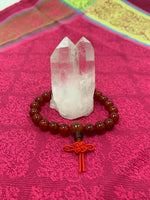 Load image into Gallery viewer, Carnelian power bracelet accented with red Chinese tassel knot. Beads are 8 mm. Carnelian promotes courage, creativity, vitality and dispels emotional negativity.
