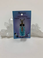 Load image into Gallery viewer, Gemstone (corked) chip bottle necklace with little turquoise chips inside, accented by a silver-colored feather and fancy jewelry bail on the outside. Silver is not sterling. Thin suede cord is included to be used as a necklace.
