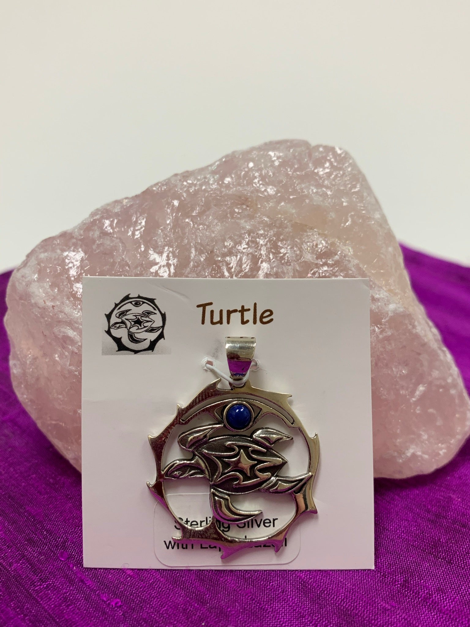 Sterling silver turtle spirit animal pendant with lapis gemstone (cab). The sea turtle is within a stylized circle, with the lapis gemstone above it. Wear your spirit animal on your chest and have it wherever you go! Pendant only - necklace chain not included. 