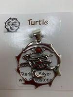 Load image into Gallery viewer, Close-up view of the sterling silver sea turtle spirit animal pendant with goldstone. Sea turtle is set within a stylized silver circle, with the goldstone above it. Where your spirit animal upon your chest so its energy is with you everywhere you go. Pendant only - necklace chain not included.
