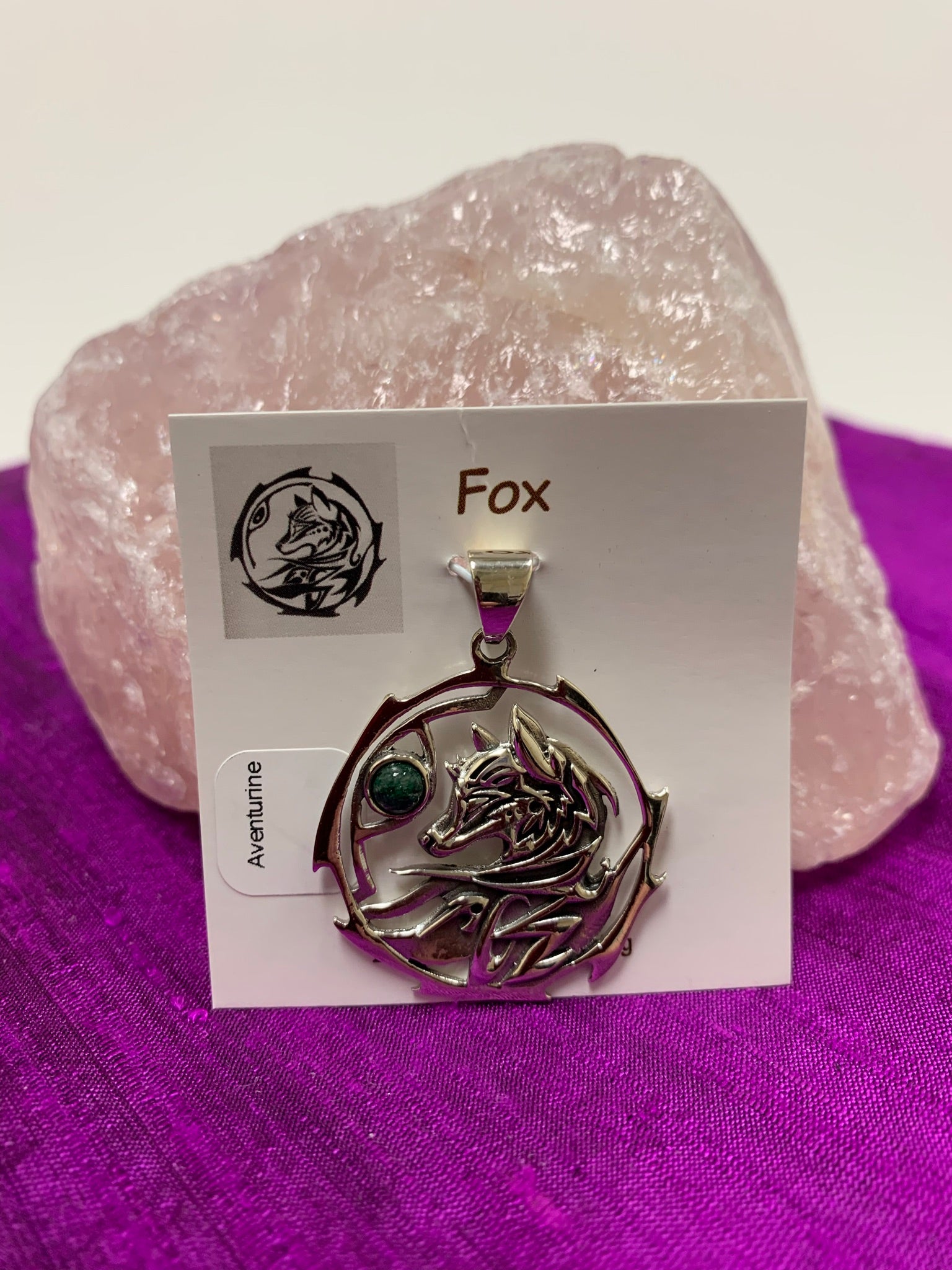 Sterling silver fox animal pendant, accented with an aventurine gemstone. The fox is set within an open, stylized circle (circle and fox are sterling). Wear your spirit animal's energy so you have it with you everywhere you go. Pendant only - necklace chain not included. 