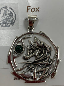 Close-up view. Sterling silver fox animal pendant, accented with an aventurine gemstone. The fox is set within an open, stylized circle (circle and fox are sterling). Wear your spirit animal's energy so you have it with you everywhere you go. Pendant only - necklace chain not included.