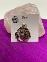 Load image into Gallery viewer, Sterling silver bear animal spirit pendant, accented with a black onyx gemstone. Bear is set within an open, stylized circle with the gemstone along the side (bear and circle are sterling). Wear your spirit animal&#39;s energy so you will have it everywhere you go! Pendant only - necklace chain not included. 
