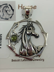 Close-up view. Sterling silver horse spirit animal pendant, accented with a peridot gemstone. Horse is set within an open, stylized circle with the gemstone on the side (horse and circle are sterling). Wear your spirit animal's energy so you will have it with you everywhere you go! Pendant only - necklace chain not included.