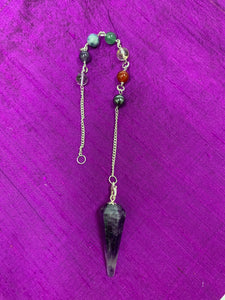 Amethyst pendulum with silver-colored chain (not sterling), accented by 7 gemstone beads, 1 for each of the 7 major chakras. A satiny lined box is included that shows the colors and names of the chakras and also the name of each of the chakra beads. 