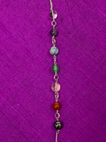 Load image into Gallery viewer, Close-up view of the 7 chakra beads displayed on the silver-colored (not sterling) pendulum chain.
