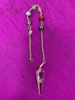 Load image into Gallery viewer, Clear quartz crystal pendulum, accented with 7 gemstone beads, one representing each of the 7 major chakras - all on a silver-colored chain (not sterling). It comes in a satin-lined box that shows the name of each chakra, each chakra color and each of the gemstone beads. This is a divination tool for accessing information from guides, angels, higher Self, etc. 
