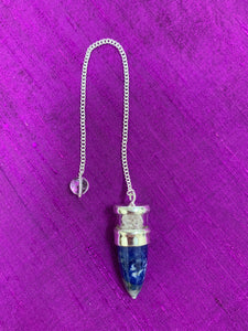 Elegant pendulum with lapis gemstone set in sterling silver with Herkimer diamond chips above it, encased in glass and a clear quartz bead at the opposite end of the silver chain. Pendulums are used as divination tools for receiving information from your guides, angels and higher Self. 