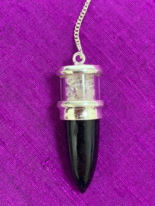 Close-up View. Elegant pendulum with black tourmaline gemstone set in sterling silver with Herkimer diamond chips above it, encased in glass and a clear quartz bead at the opposite end of the silver chain. Pendulums are used as divination tools for receiving information from your guides, angels and higher Self. Cost is $30.